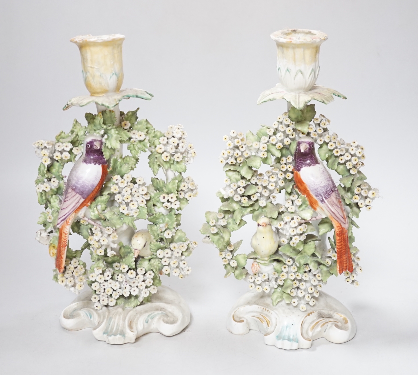 A pair of Derby ‘bird’ candlesticks, c.1760-5, 28cm